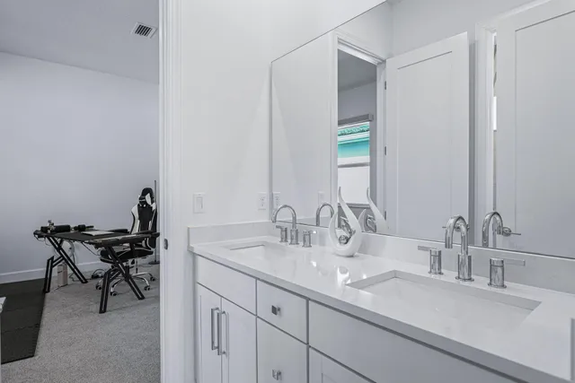 a bathroom with a sink and a mirror