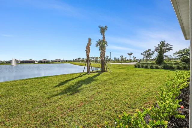 a view of a lake with houses in the back