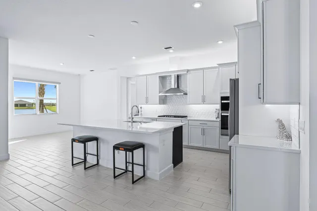 a kitchen with a sink cabinets and window