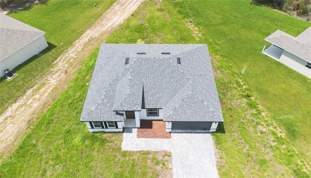 13265 Southwest 85th Circle Ocala, FL 34473 - Photo 5 of 53 an aerial view of a house with a garden and swimming pool