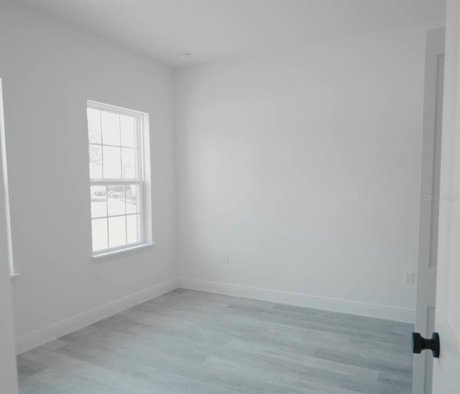 13265 Southwest 85th Circle Ocala, FL 34473 - Photo 53 of 53 an empty room with a window
