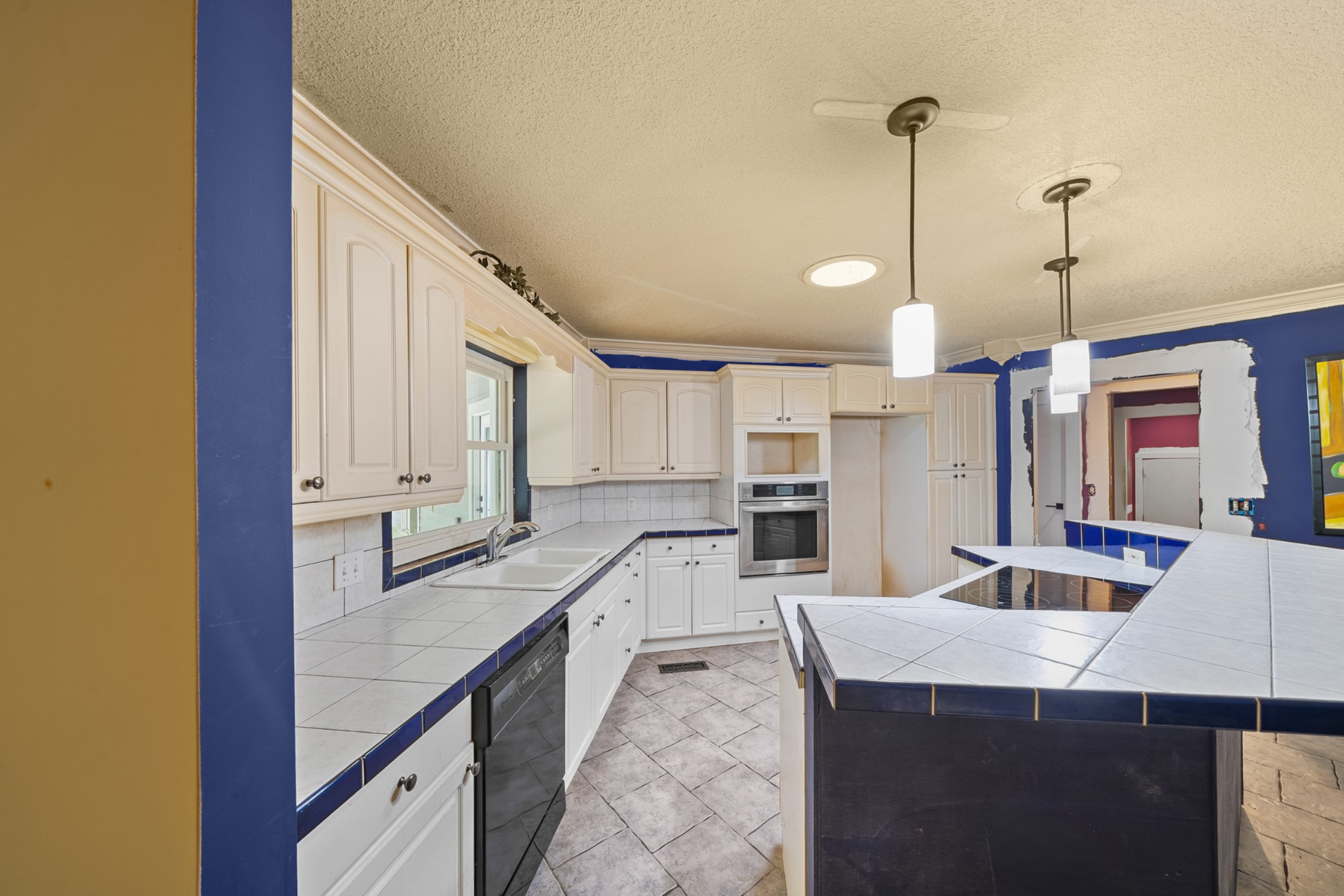 3287 Keith Springs Mountain Road Belvidere, TN 37306 - Photo 19 of 57 a kitchen with stainless steel appliances kitchen island granite countertop a sink and cabinets