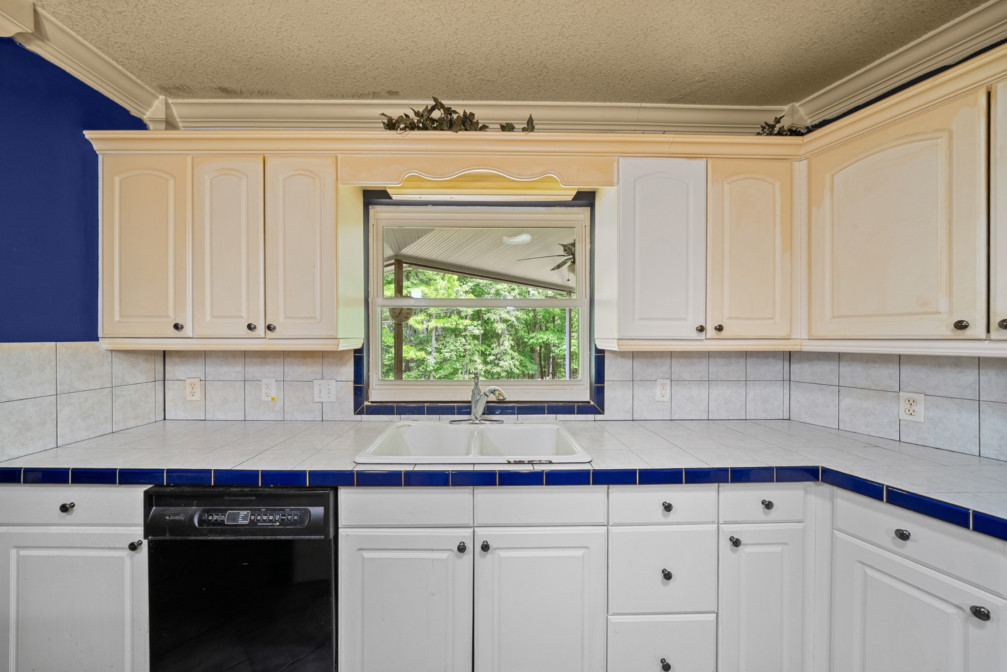 3287 Keith Springs Mountain Road Belvidere, TN 37306 - Photo 21 of 57 a kitchen with granite countertop white cabinets and white appliances