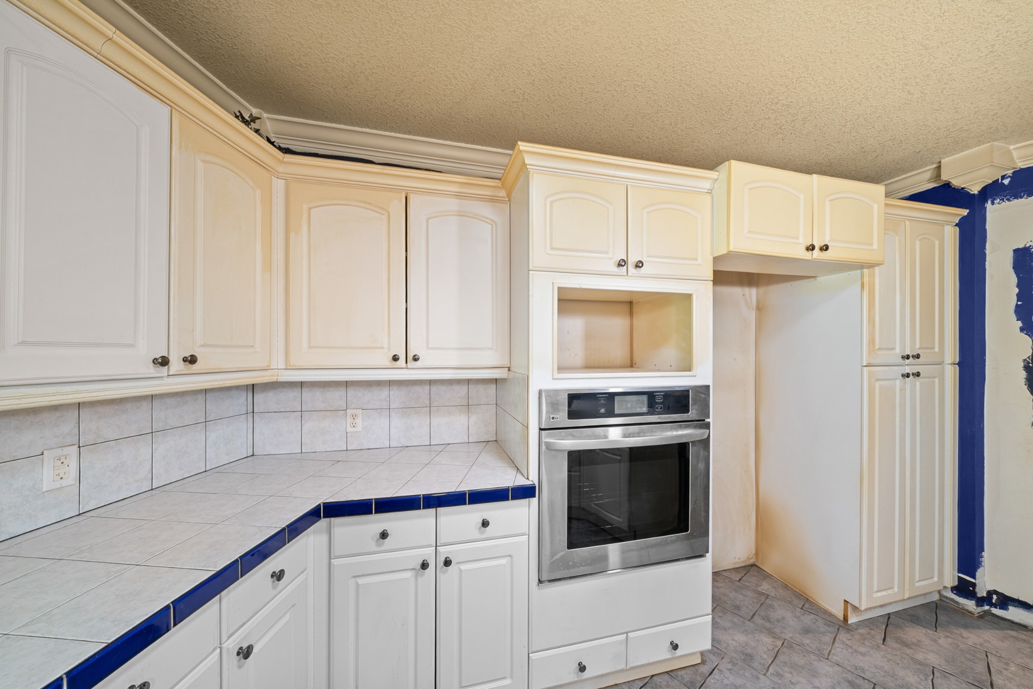 3287 Keith Springs Mountain Road Belvidere, TN 37306 - Photo 22 of 57 a kitchen with granite countertop white cabinets and stainless steel appliances