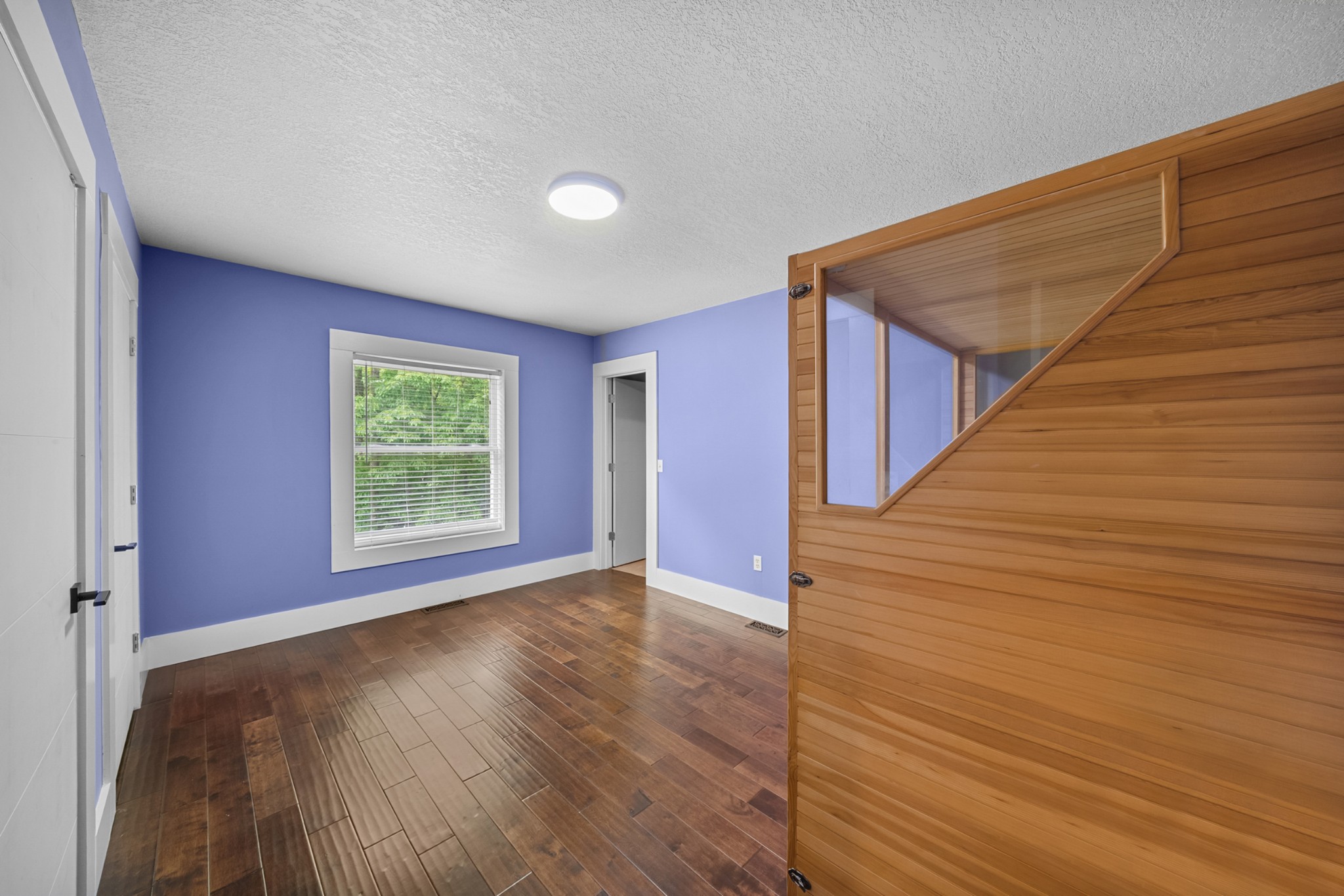 3287 Keith Springs Mountain Road Belvidere, TN 37306 - Photo 27 of 57 a view of an empty room with wooden floor and a window