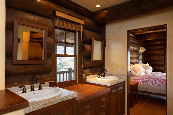 a bathroom with a sink double vanity and a mirror