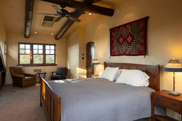 a bedroom with a bed and a couch