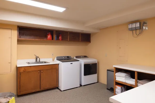a kitchen with a sink and cabinets