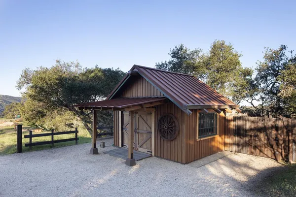 a house with trees in the background