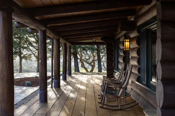 a view of a hallway with wooden floor and glass door