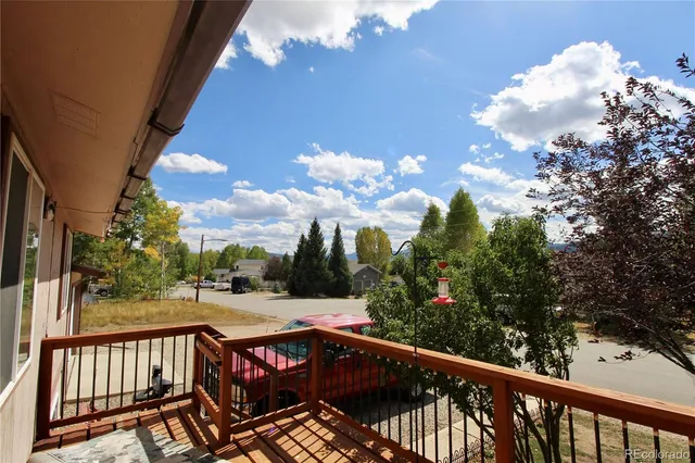 a view of a balcony with wooden floor