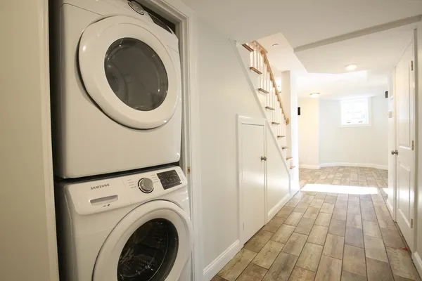 a view of a hallway with washer and dryer