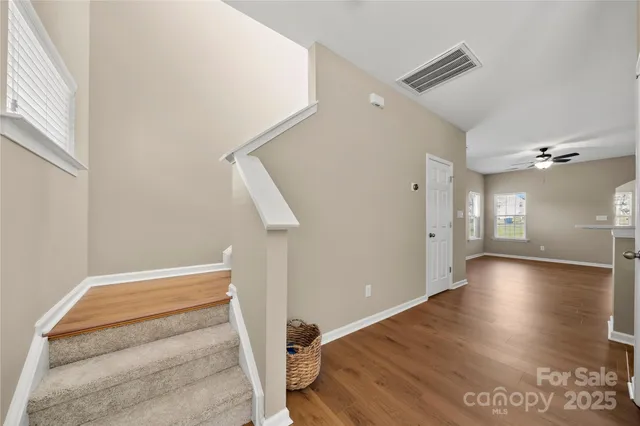 a view of entryway with wooden floor