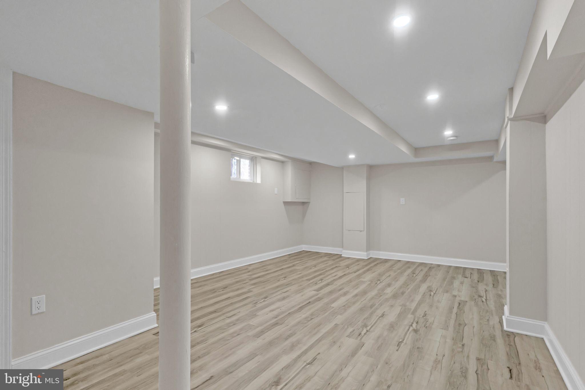 11901 Dalewood Drive Silver Spring, MD 20902 - Photo 13 of 17 wooden floor in an empty room with a window