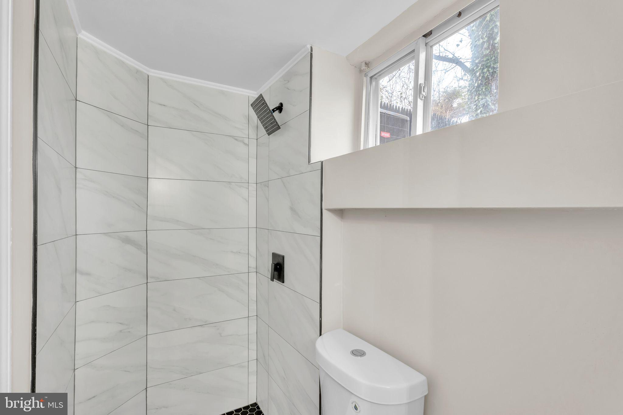 11901 Dalewood Drive Silver Spring, MD 20902 - Photo 15 of 17 a bathroom with a toilet and a shower