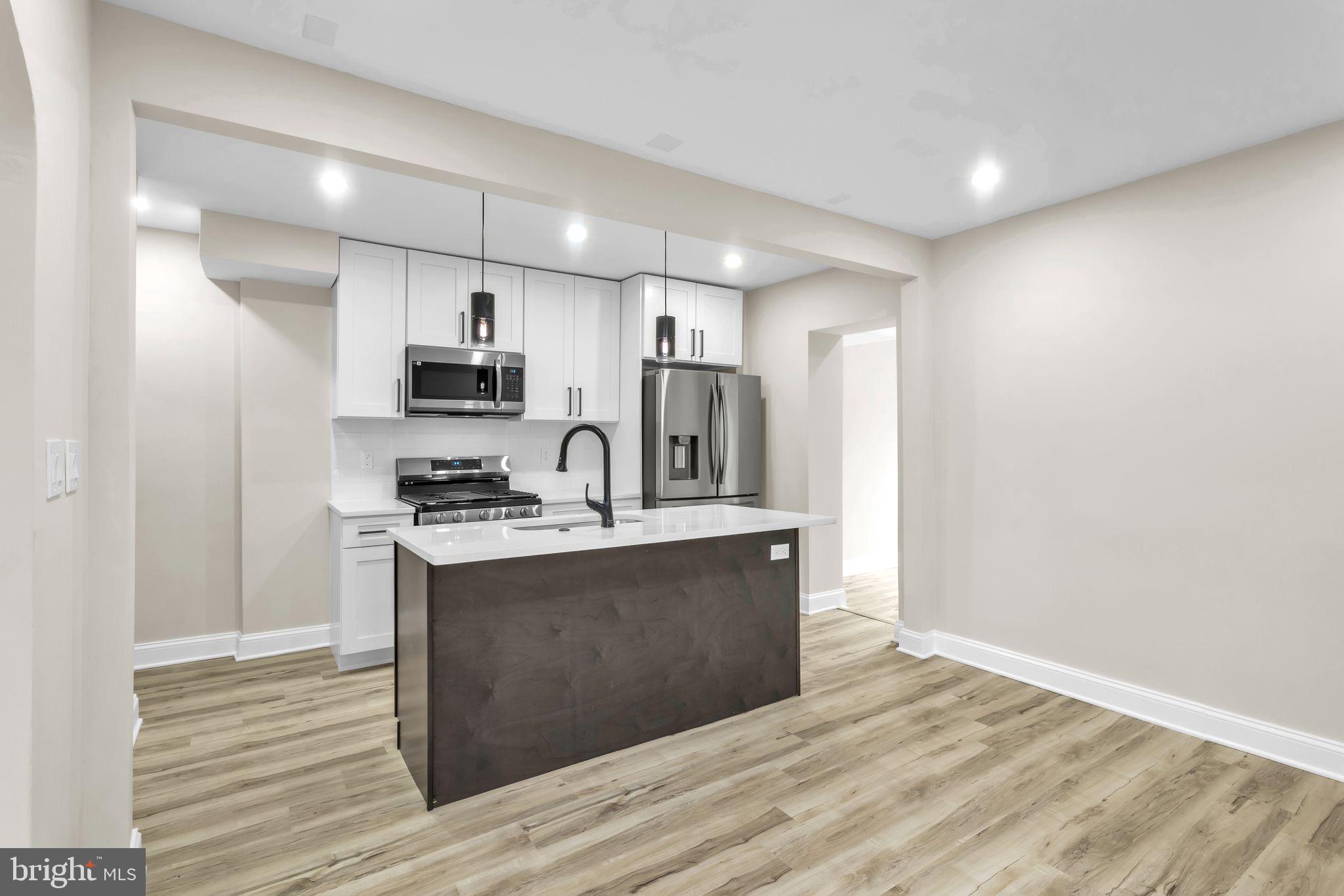 11901 Dalewood Drive Silver Spring, MD 20902 - Photo 3 of 17 a view of kitchen with sink microwave and refrigerator