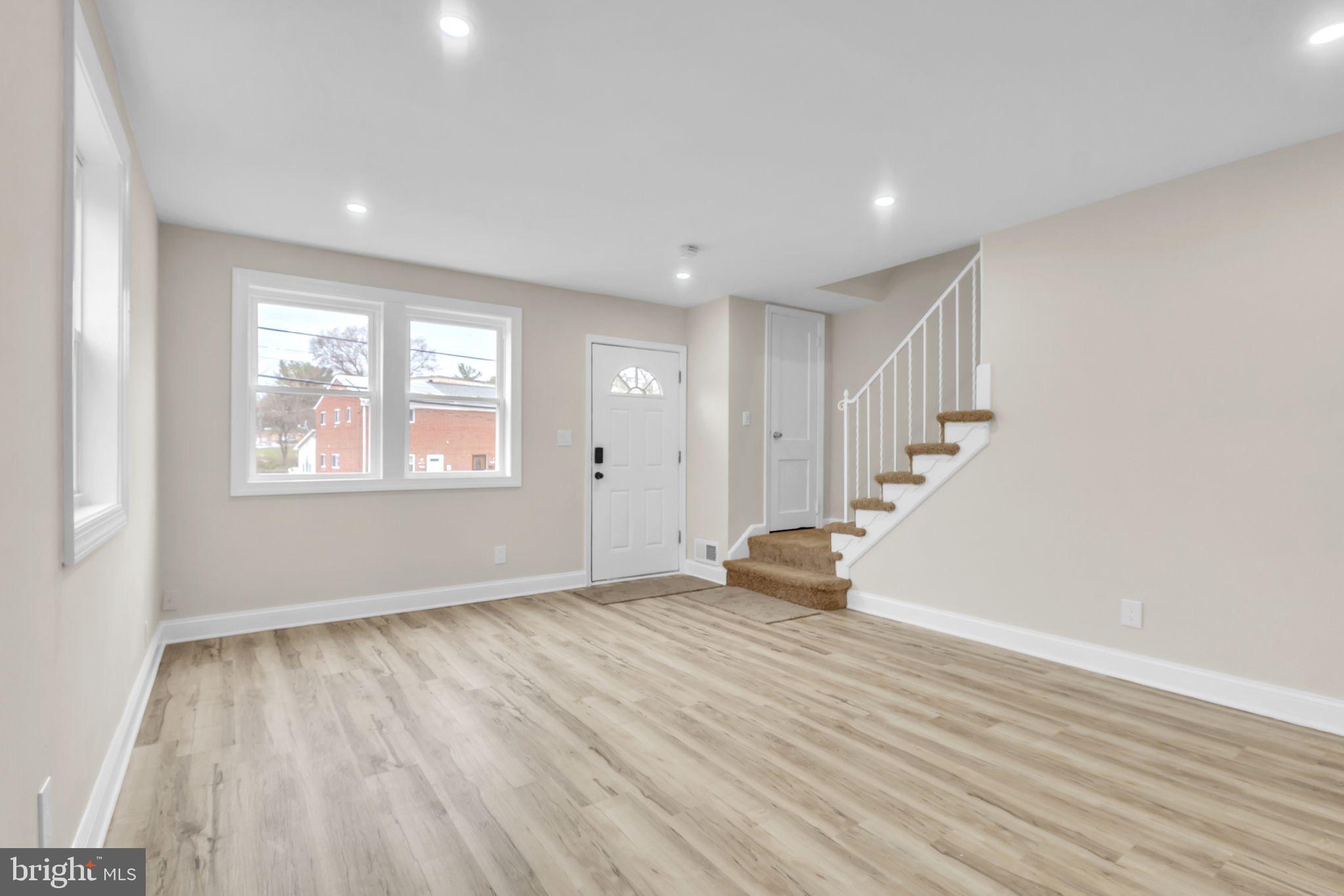 11901 Dalewood Drive Silver Spring, MD 20902 - Photo 5 of 17 a view of an empty room with wooden floor and a window