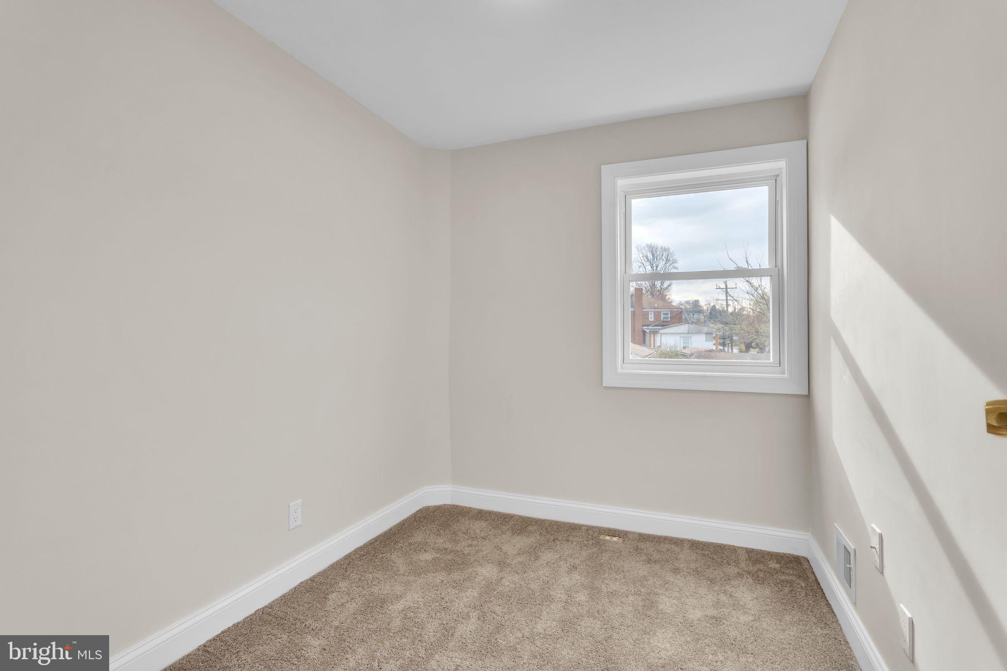11901 Dalewood Drive Silver Spring, MD 20902 - Photo 9 of 17 an empty room with windows