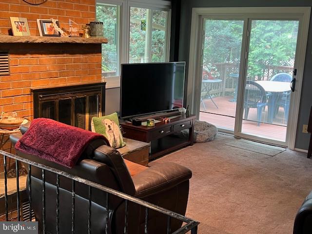 90 Wanner Road Reading, PA 19606 - Photo 14 of 32 a living room with furniture a flat screen tv and a floor to ceiling window