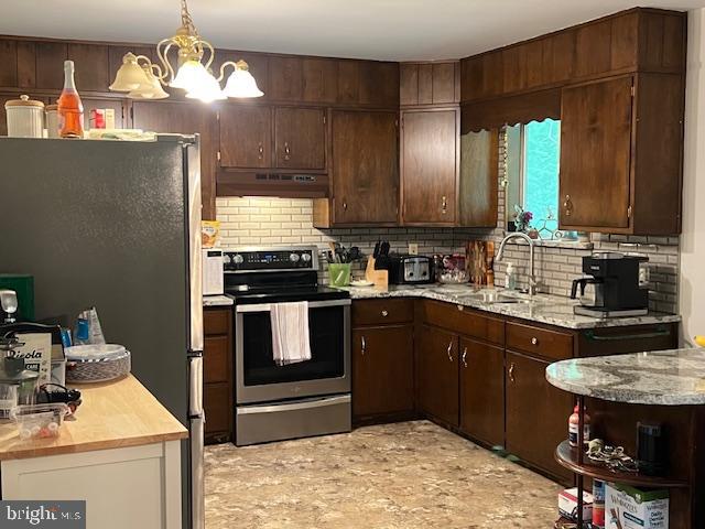 90 Wanner Road Reading, PA 19606 - Photo 15 of 32 a kitchen with a stove and a refrigerator