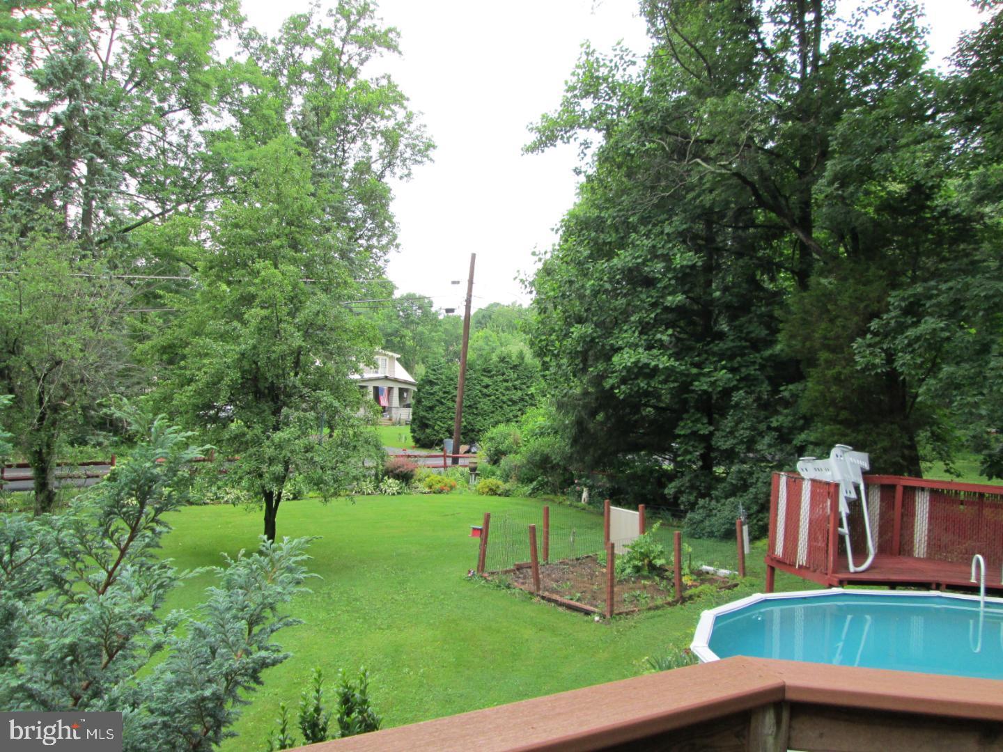 90 Wanner Road Reading, PA 19606 - Photo 4 of 32 a view of backyard with deck and trees