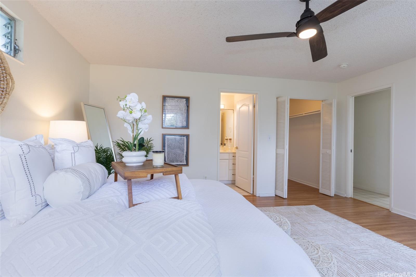 176 Kuulei Road Kailua, HI 96734 - Photo 8 of 25 Primary bedroom looking towards large walk in closet and primary bathroom.