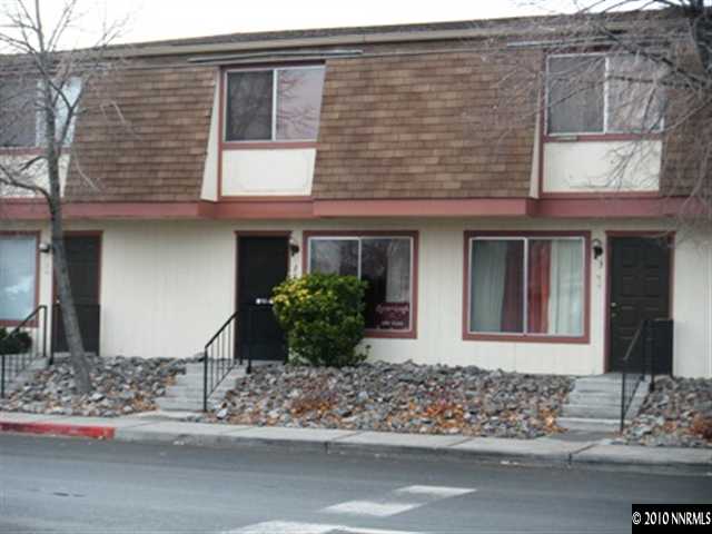 1400 East 9th Street, Unit 2 Reno, NV 89512 - Photo 1 of 7 a front view of a house with a yard and garage