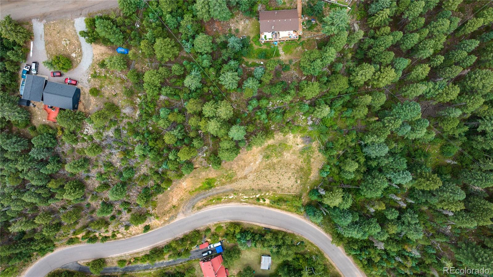 10126 Crest View Drive Morrison, CO 80465 - Photo 11 of 14 an aerial view of a house with a yard and lake view