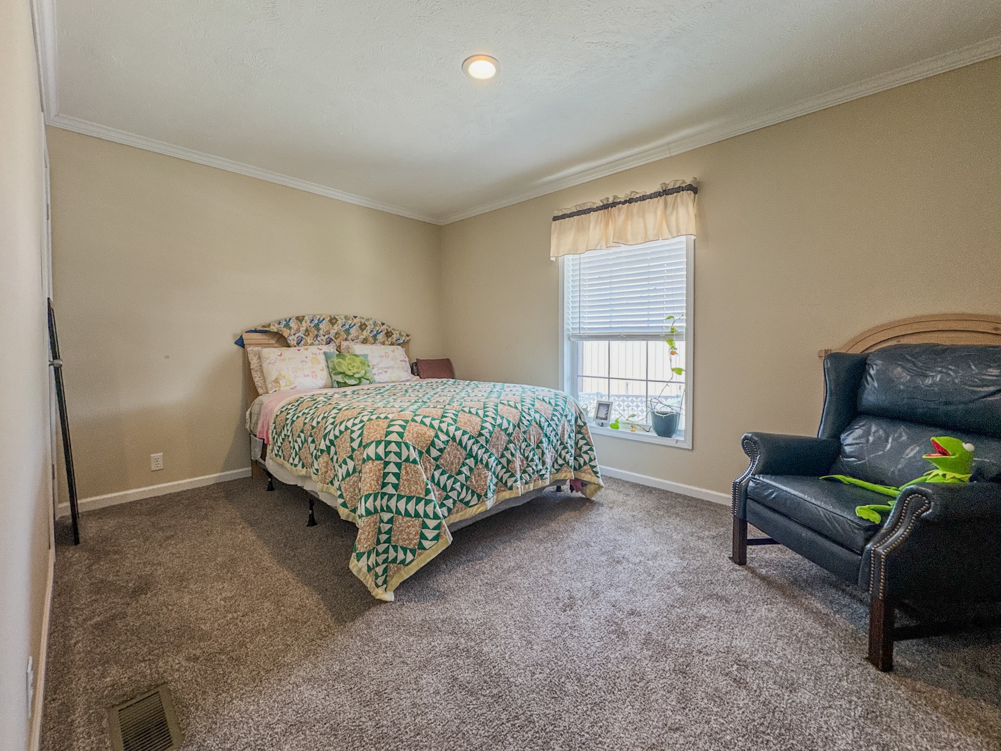 1198 David Patterson Road Lutts, TN 38471 - Photo 31 of 82 a bedroom with a bed and a couch