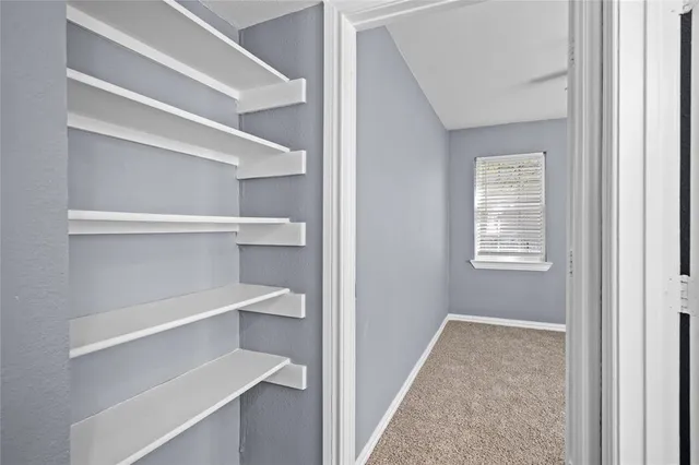 a view of a hallway with closet