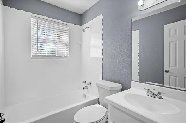 a bathroom with a sink toilet and bathtub