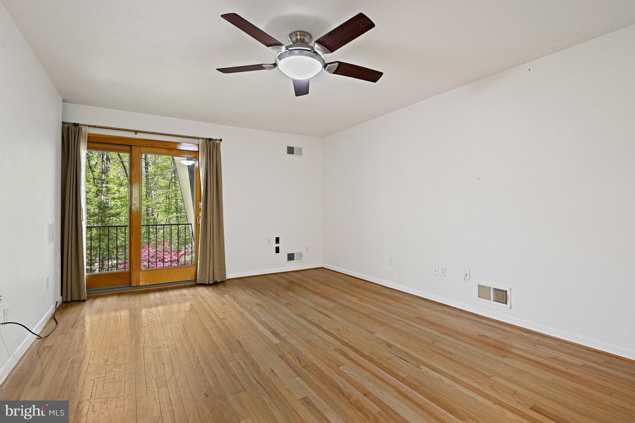 12008 Whip Road Reston, VA 20191 - Photo 22 of 48 Primary bedroom with sliding door to balcony.