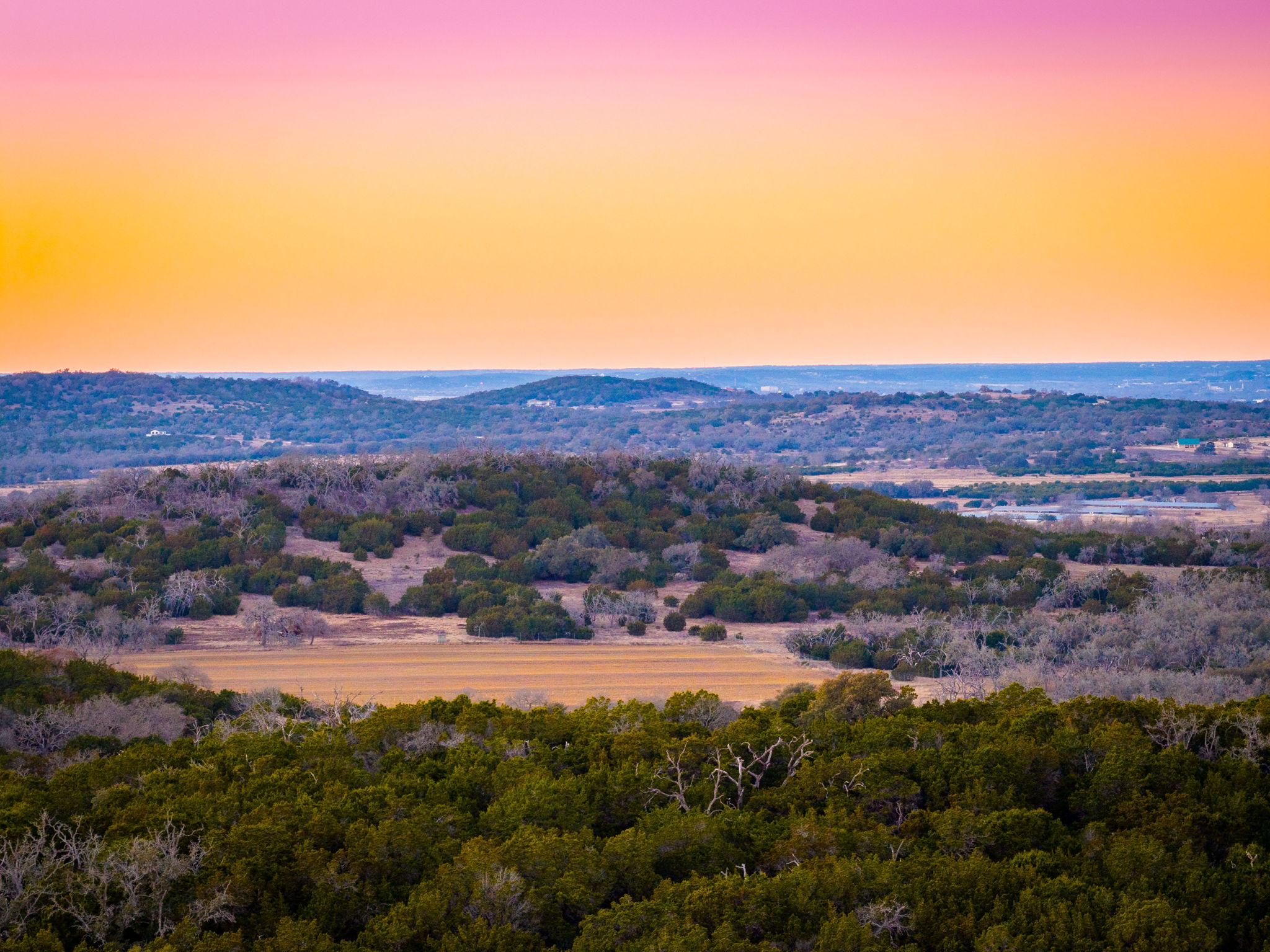 Tbd Steitle Road Fredericksburg, TX 78624 - Photo 3 of 25 a view of a grassy area with mountains and a houses