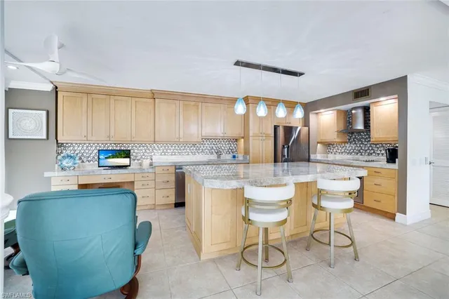 a kitchen with a table and chairs in it