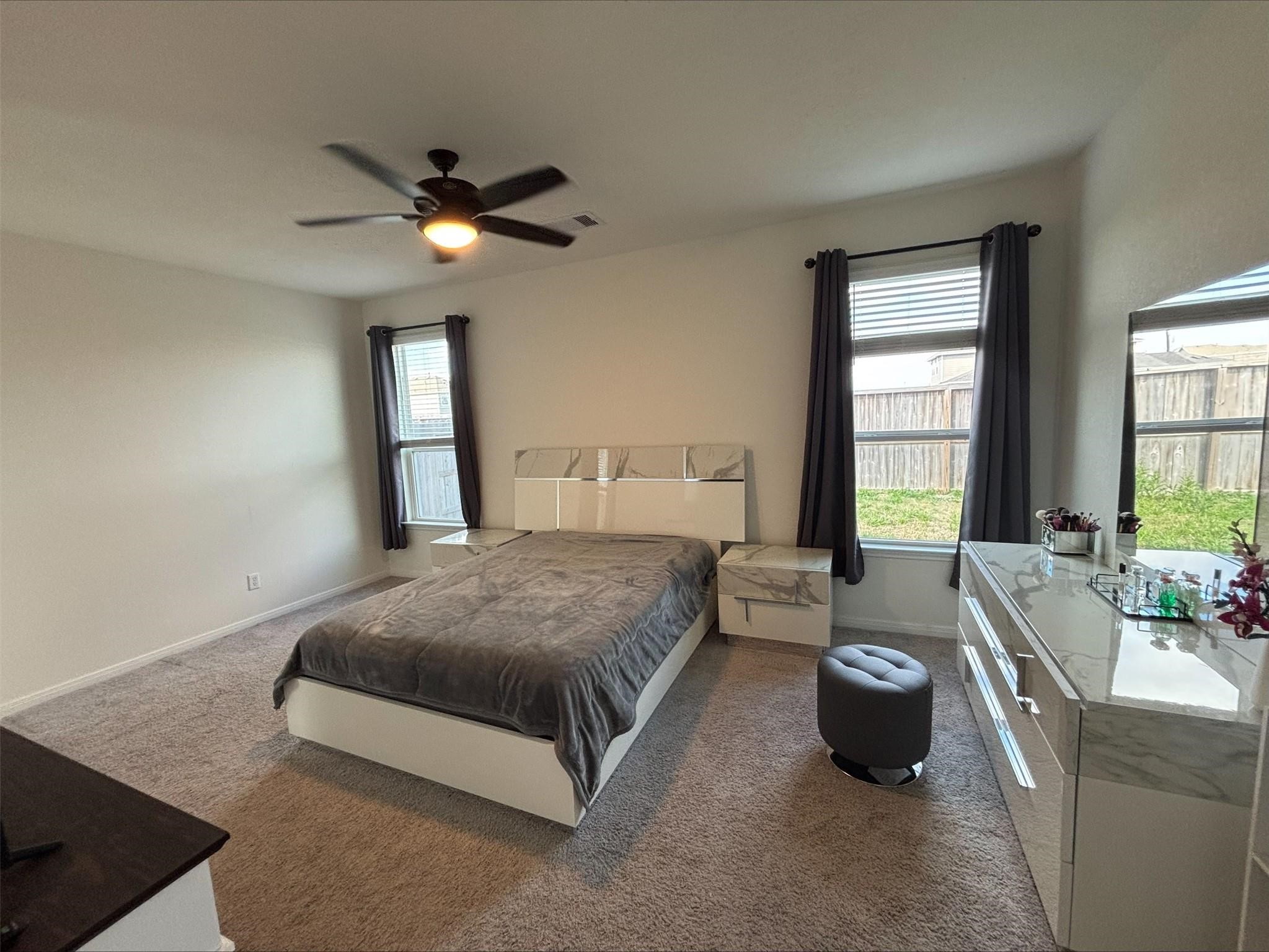 1323 Rosemead Drive Rosharon, TX 77583 - Photo 13 of 27 a bedroom with a bed and a chandelier