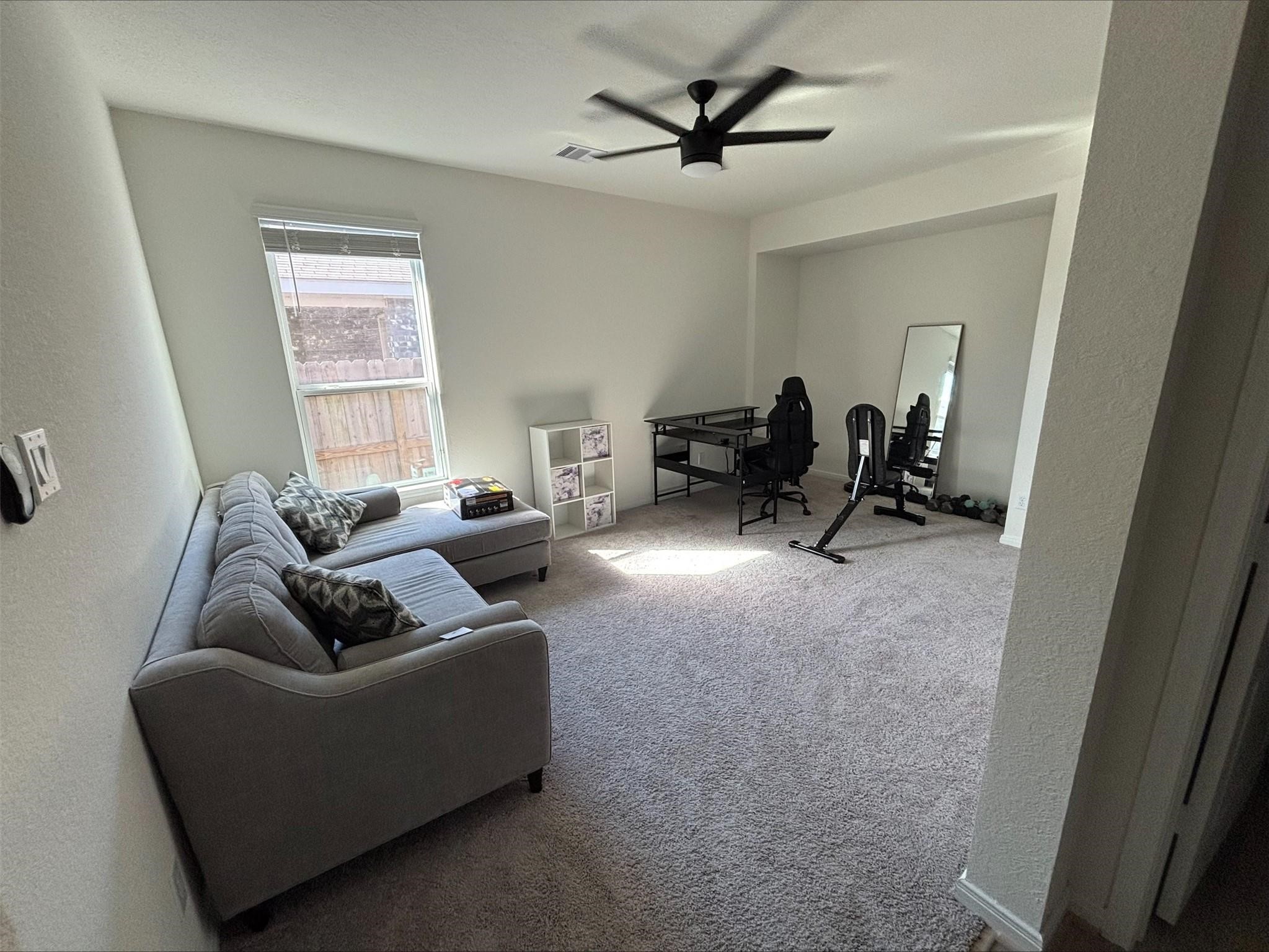 1323 Rosemead Drive Rosharon, TX 77583 - Photo 16 of 27 This versatile front room is perfect as a cozy bedroom, sleek office, or inviting TV lounge, offering endless possibilities to suit your lifestyle.