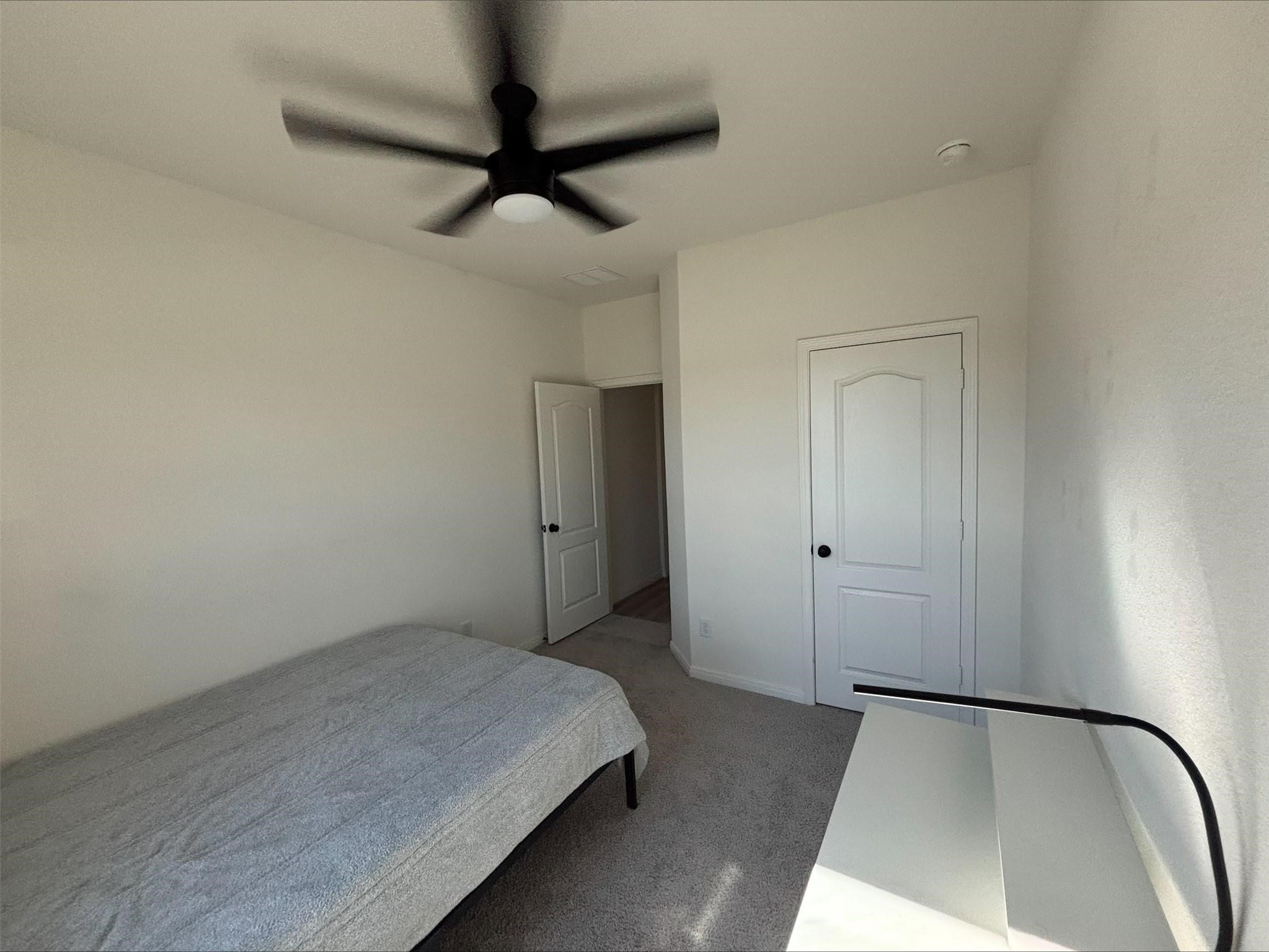 1323 Rosemead Drive Rosharon, TX 77583 - Photo 19 of 27 a view of a room with a dresser and a ceiling fan