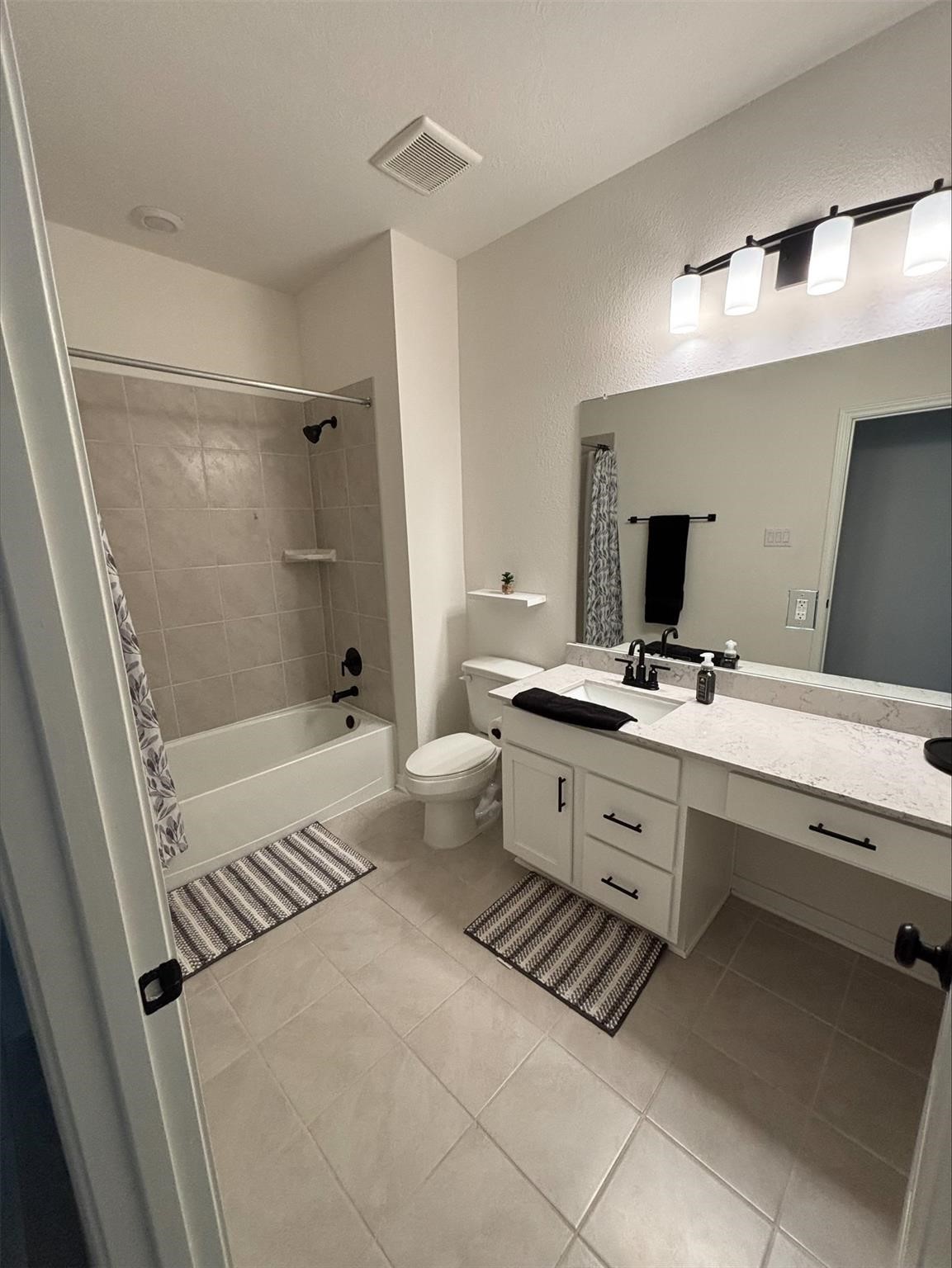 1323 Rosemead Drive Rosharon, TX 77583 - Photo 23 of 27 a bathroom with a sink a toilet a mirror and shower
