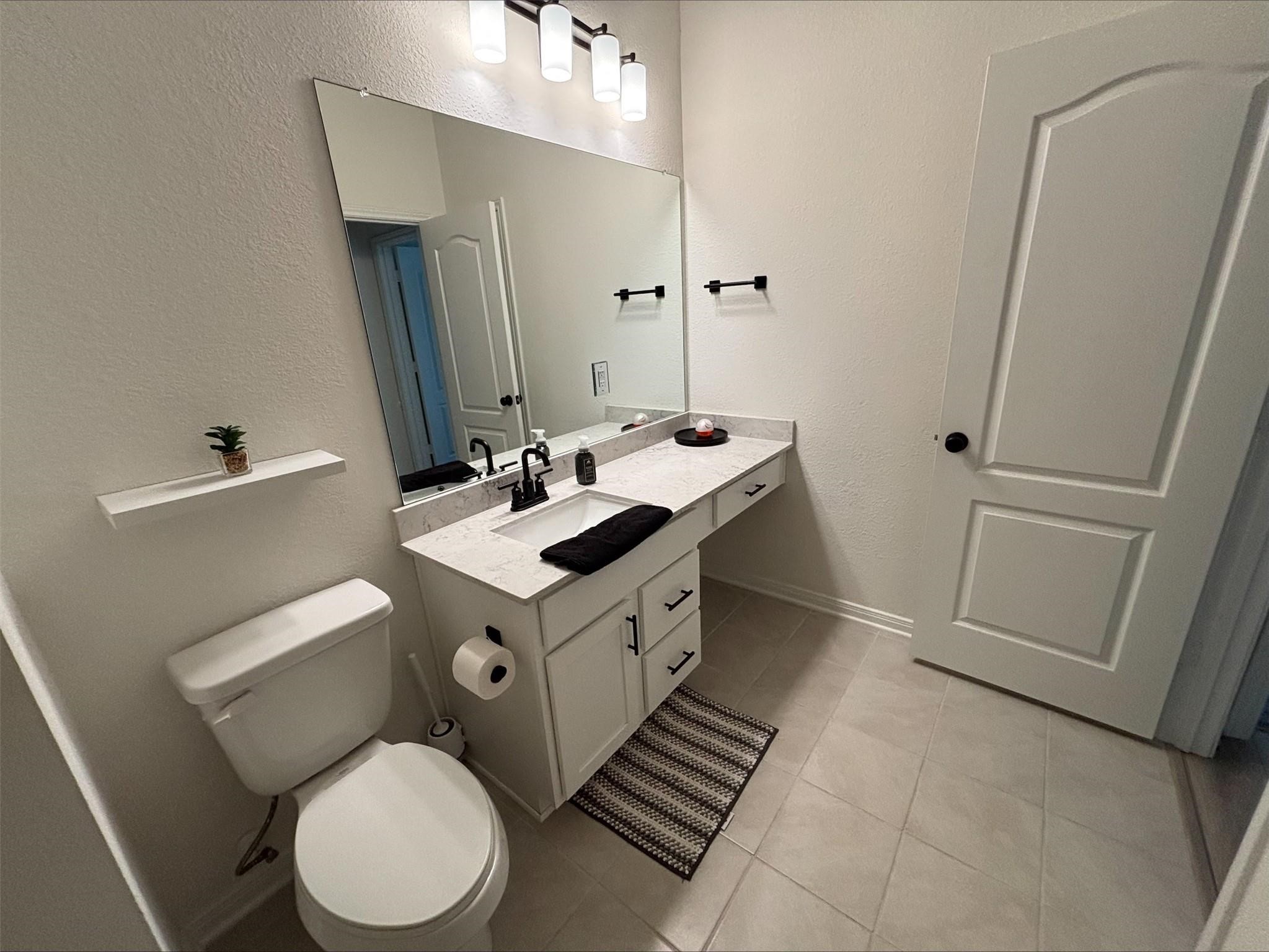 1323 Rosemead Drive Rosharon, TX 77583 - Photo 24 of 27 a bathroom with a sink toilet and shower