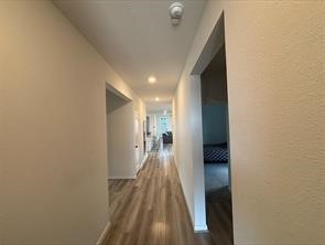 1323 Rosemead Drive Rosharon, TX 77583 - Photo 9 of 27 a view of hallway with wooden floor