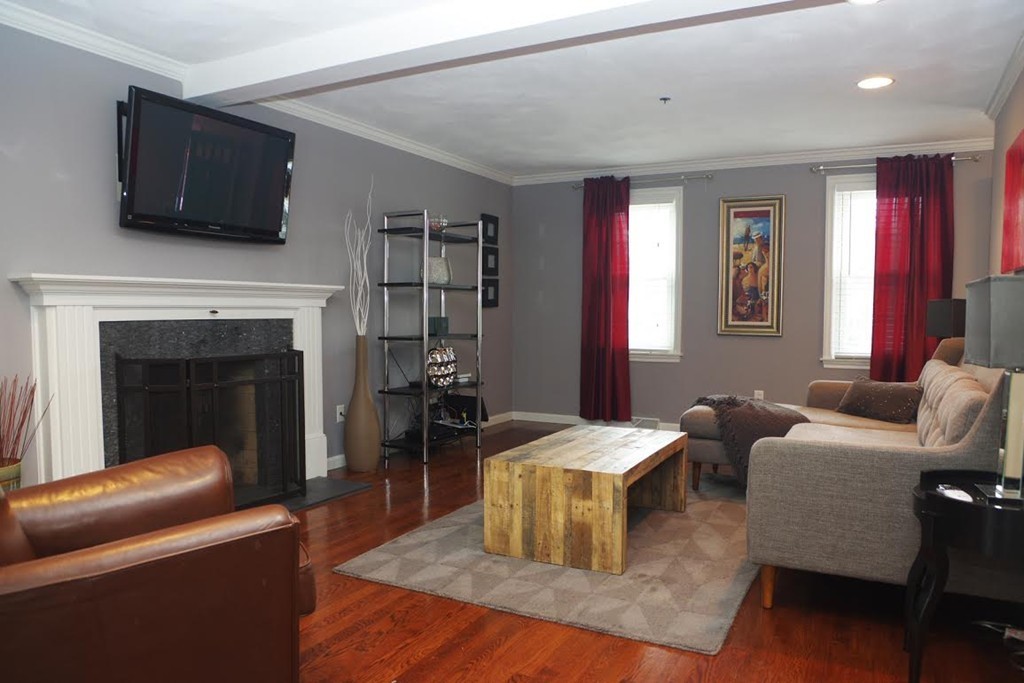 2 Ridge Road Haverhill, MA 01830 - Photo 6 of 23 a living room with furniture a flat screen tv and a fireplace