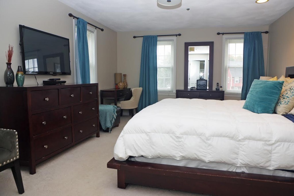 2 Ridge Road Haverhill, MA 01830 - Photo 7 of 23 a bedroom with a bed and a flat tv screen on dresser