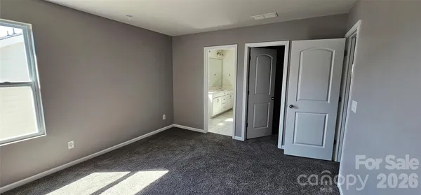 a bathroom with a bathtub sink and mirror