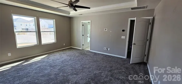 a bathroom with a shower and a glass door