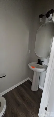 a bathroom with a sink and toilet