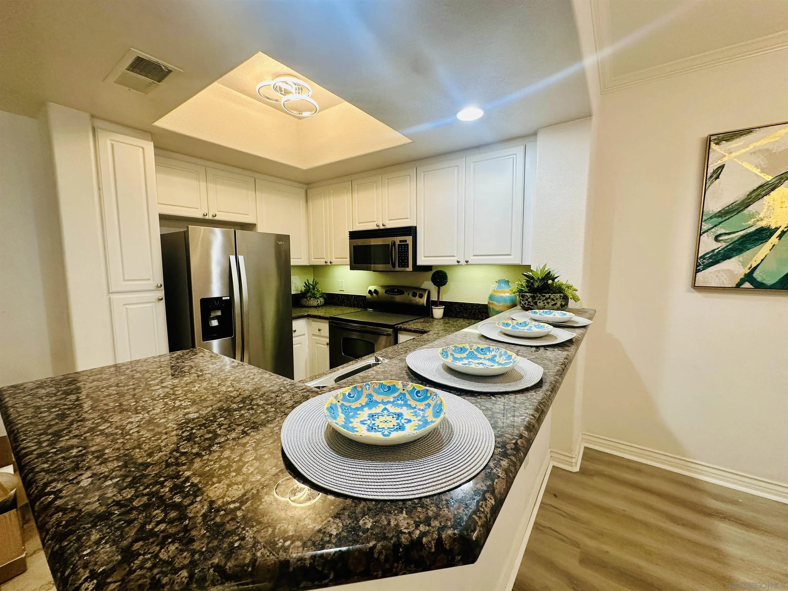 9263 Regents Road, Unit B204 La Jolla, CA 92037 - Photo 5 of 17 a kitchen with a stove and refrigerator
