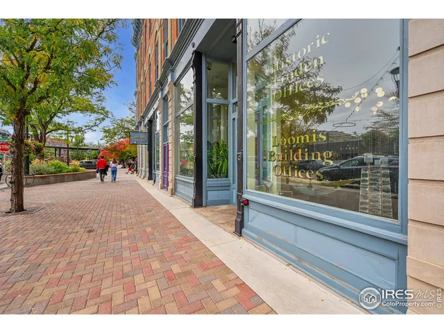 a picture of a bench in front of a building