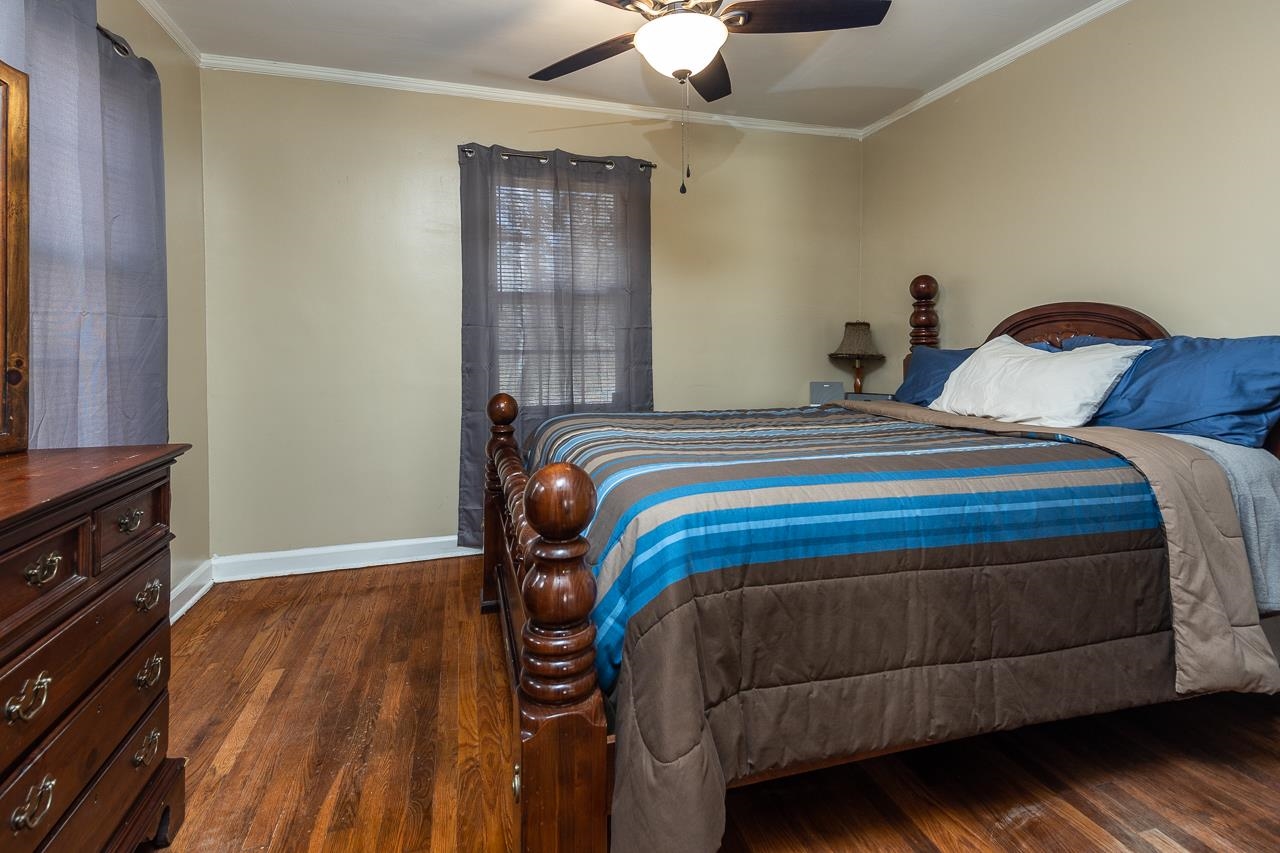 456 Gerald Road Memphis, TN 38122 - Photo 15 of 25 a bedroom with a bed and a dresser