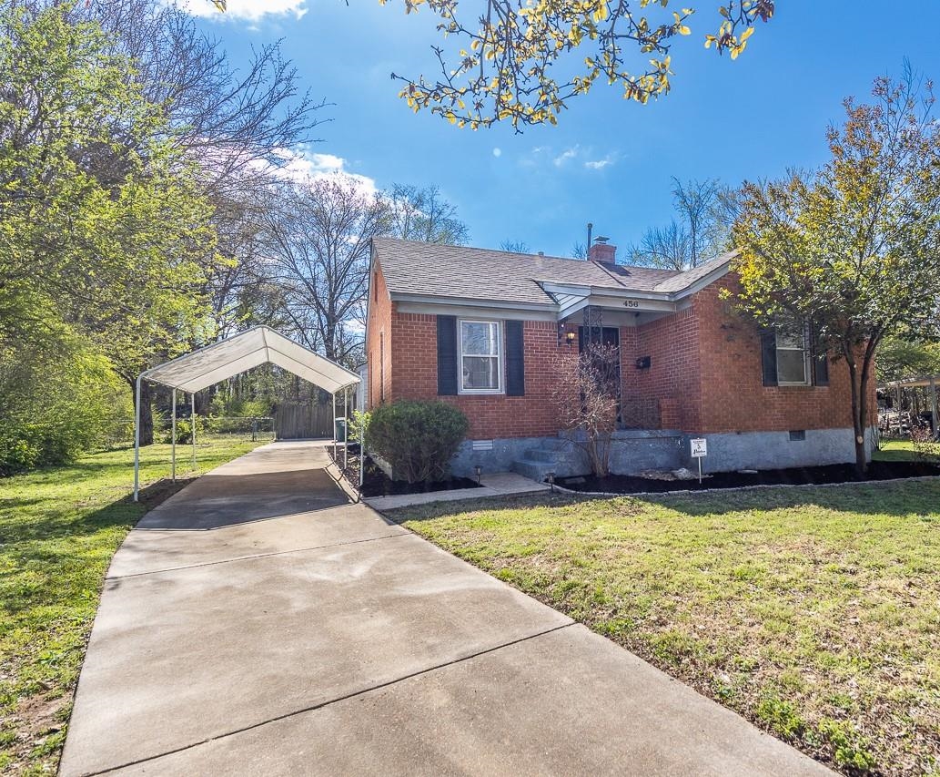 456 Gerald Road Memphis, TN 38122 - Photo 2 of 25 a view of a house with garden and a tree