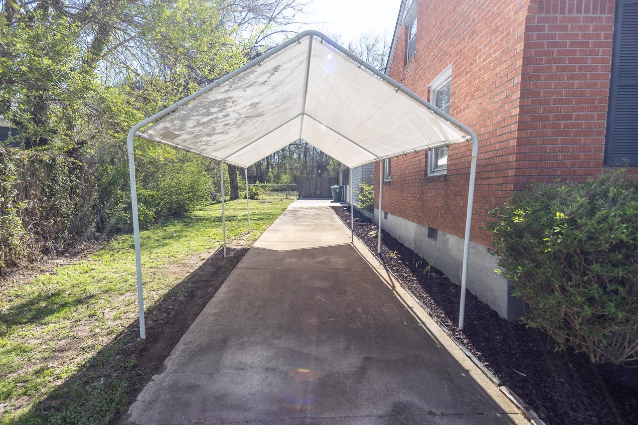 456 Gerald Road Memphis, TN 38122 - Photo 25 of 25 a view of a house with backyard and trees
